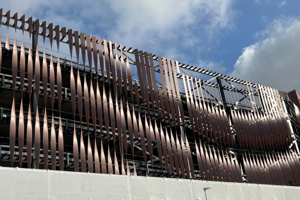 Swansea car park’s pink twisted fin façade is beginning to take formation